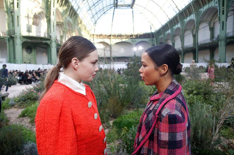 Actress Kristine Froseth, left, talks with Canadian actress Taylor Russell before the Chanel Haute Couture Spring/Summer 2020 show. AP