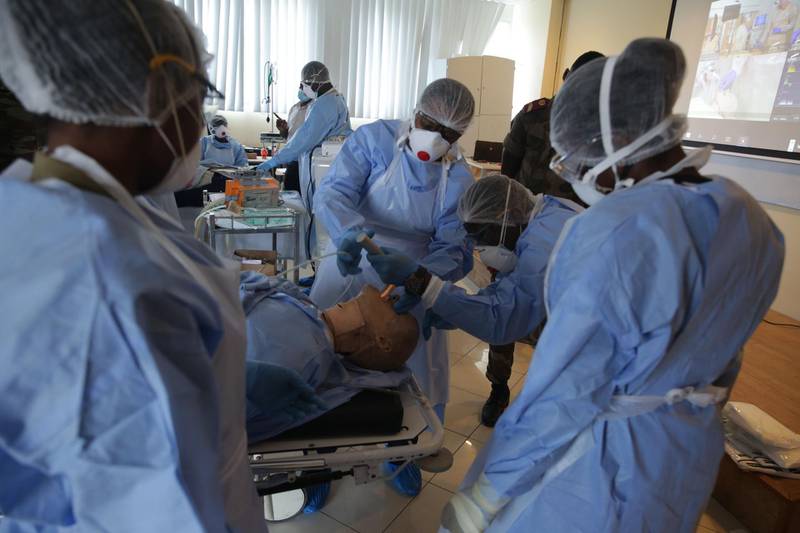 Medical staff members during training for resuscitation techniques at the School of Military Health Enforcement in Libreville, France. AFP