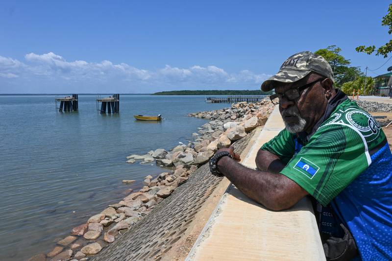 Plaintiff Paul Kabai, who is among those suing the Australian government, looking over the seawall on Boigu Island in the Torres Strait. AFP