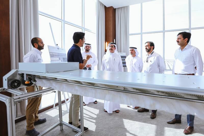 Dewa managing director and chief executive Saeed Al Tayer with executives at the Mohammed bin Rashid Al Maktoum Solar Park. Photo: Dewa