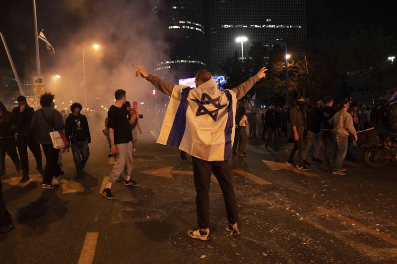 Israeli demonstrators in Tel Aviv block streets and clash with police during a protest against plans by Prime Minister Benjamin Netanyahu's government to overhaul the judicial system. AP