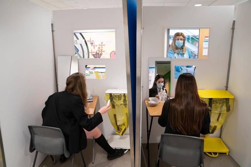 Students at Great Academy Ashton are taken through the Covid testing proceedure, as the school prepares for its reopening on March 8, in Ashton-Under-Lyne, England. AP Photo