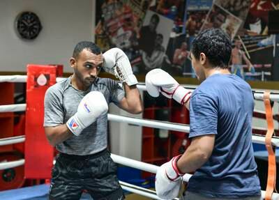 Sultan Al Nuaimi, left, during training at Round 10 Gym in Al Qouz, Dubai. All images Khushnum Bhandari / The National
