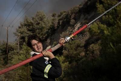 A firefighter tackles a blaze outside the village of Vati, Greece. Getty