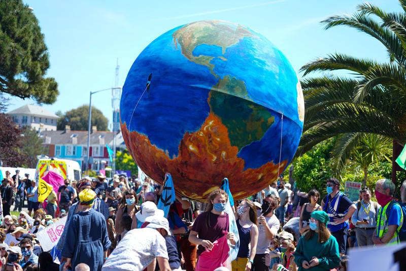 Climate demonstrators march through the centre of Falmouth, Cornwall. Getty