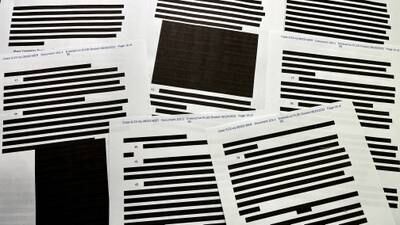 Pages of entirely redacted information in the released version of an affidavit from the US Justice Department that was submitted to a judge to support the execution of the FBI search warrant. Reuters