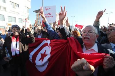 Tunisian protesters rally against the president's seizure of governing powers. EPA