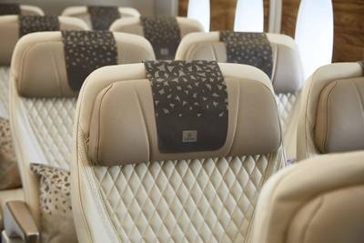 Emirates' Premium Economy seats feature anti-stain leather and luxurious stitching details.