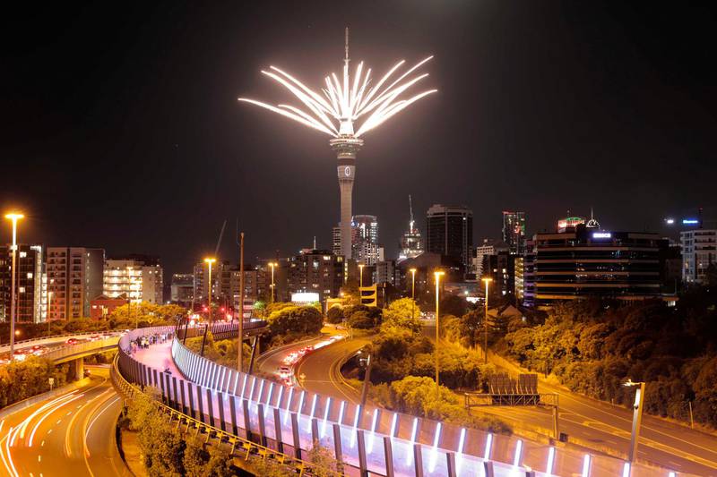 Fireworks are launched from the Sky Tower to mark the changing of the year in Auckland, New Zealand. The country and its South Pacific island neighbours have no cases of Covid-19, and New Year celebrations there are the same as ever. AP