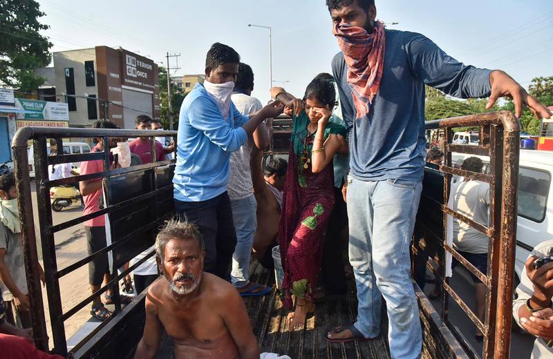 People affected by a chemical gas leak are carried out of a lorry to an ambulance in Visakhapatnam, India. AP Photo