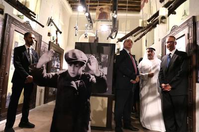 Israel's Ambassador to the UAE, Eitan Na'eh, third right, Ahmed Al Mansuri, founder of Crossroads of Civilisation Museum, second right, and German Ambassador in UAE, Peter Fischer, right, at the exhibition. AP Photo
