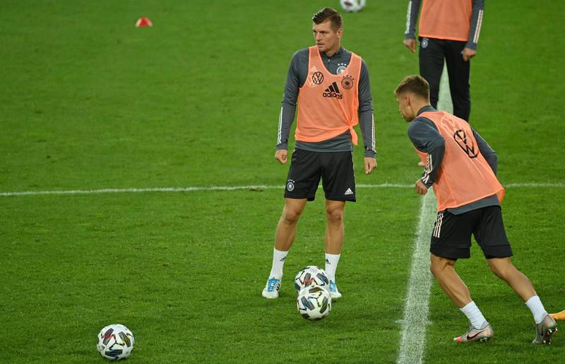 Toni Kroos and Joshua Kimmich take part in a training session at the Rheinenergie Stadium. AFP
