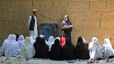 Afghan school girls attend a class at an open-air primary school in the Khogyani district of Nangarhar province in May this year, almost two years after their right to education were reduced. AFP