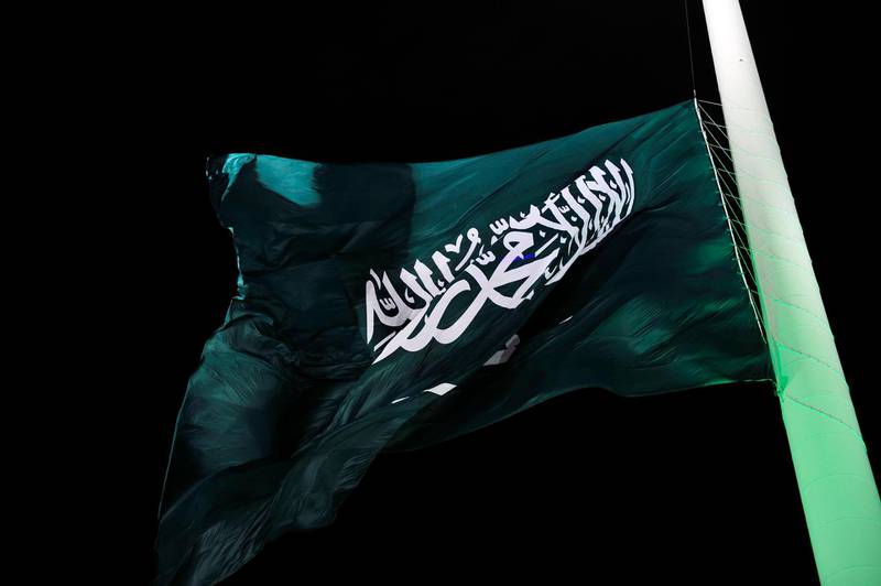 (FILES) In this file photo taken on September 23, 2014, the flag of  Saudi Arabia is hoisted onto the world's tallest flagpole in Jeddah.   The US Commission on International Religious Freedom on April 26, 2019, urged action against ally Saudi Arabia after its mass execution of 37 people, most of them Shiite Muslims. The Commission, whose members are appointed by the president and lawmakers across party lines but whose role is advisory, said the State Department "must stop giving a free pass" to Saudi Arabia.
 / AFP / STR
