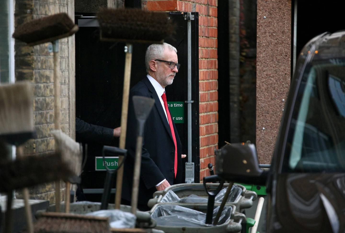 Britain's opposition Labour Party leader Jeremy Corbyn leaves Islington Town Hall through the backdoor after a meeting following the results of the general election in London, Britain, December 13, 2019. REUTERS/Tom Nicholson NO RESALES. NO ARCHIVES.