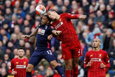 Liverpool's Virgil van Dijk takes on Bournemouth's Callum Wilson. Reuters