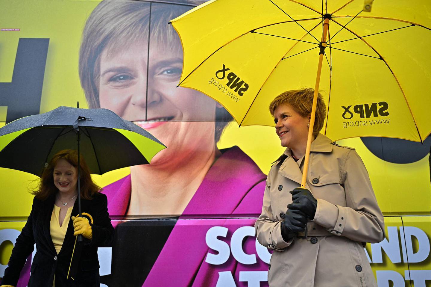 Scotland's First Minister and leader of the Scottish National Party (SNP), Nicola Sturgeon (R) and Joan McAlpine campaign in Midsteeple Quarter in Dumfries, Scotland on May 3, 2021, ahead of the upcoming Scottish Parliament election which is to be held on May 6, 2021.   / AFP / POOL / Jeff J Mitchell
