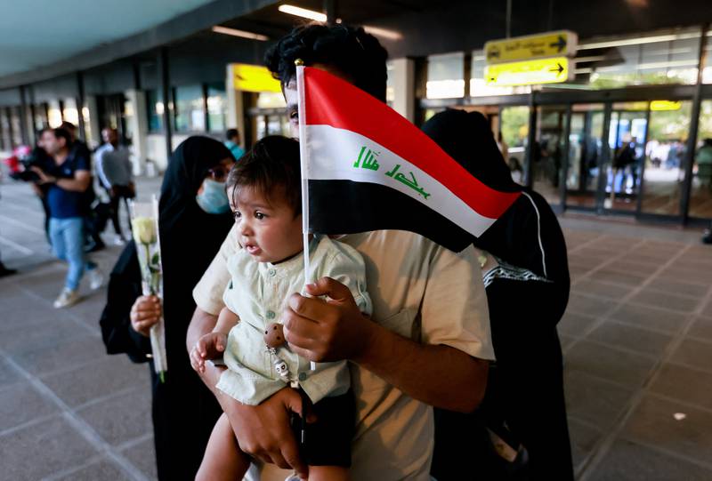 Iraqi and Syrian evacuees arrive at Baghdad International Airport. Reuters