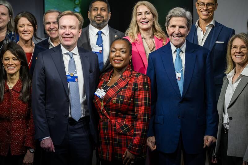 From second left, WEF president Borge Brende, Carbon Direct vice chairwoman Nili Gilbert and US climate envoy John Kerry with other delegates in Davos. EPA