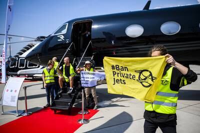 Environmental activists engage in a climate protest at the European Business Aviation Convention and Exhibition at Geneva Airport in Switzerland. EPA