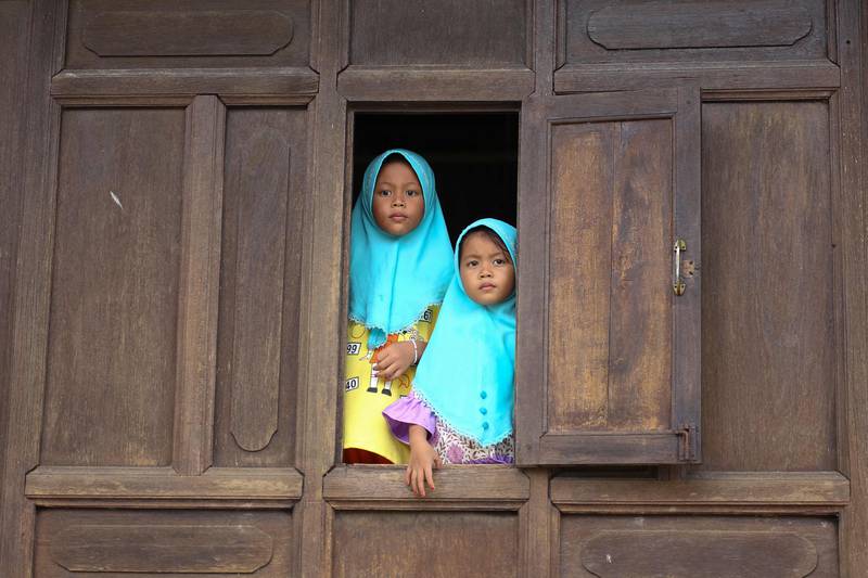Girls during a visit to Wadi Hussein mosque, also known as the Talo Mano mosque – one of the oldest mosques in Thailand – on a public holiday after Eid Al Fitr in the southern Thai province of Narathiwat. AFP
