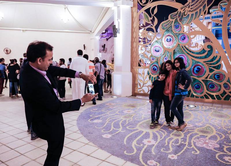 Visitors take photos at the opening of the world’s first Bollywood theme park, Bollywood Parks Dubai in Jebel Ali. Victor Besa for The National