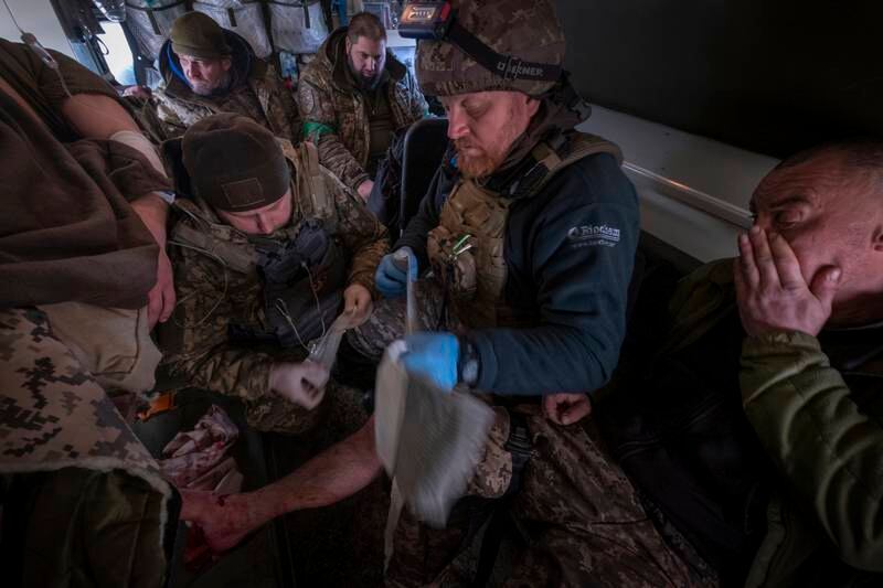 A Ukrainian soldier is taken to a field hospital. EPA