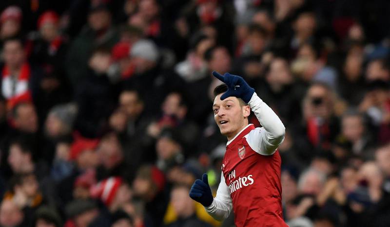 Soccer Football - Premier League - Arsenal vs Newcastle United - Emirates Stadium, London, Britain - December 16, 2017   Arsenal's Mesut Ozil celebrates scoring their first goal   Action Images via Reuters/Tony O'Brien    EDITORIAL USE ONLY. No use with unauthorized audio, video, data, fixture lists, club/league logos or "live" services. Online in-match use limited to 75 images, no video emulation. No use in betting, games or single club/league/player publications.  Please contact your account representative for further details.