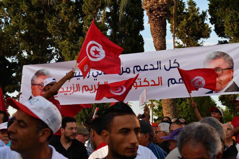 Supporters of former Tunisian defence minister and presidential candidate Abdelkrim Zbidi (not pictured) gather during his presidential campagne tour in the central coast city of Monastir.  Campaigning for Tunisia's presidential election opened on September 2 with 26 candidates vying to replace late leader Beji Caid Essebsi in a vote seen as vital to defending democratic gains in the cradle of the Arab Spring. AFP