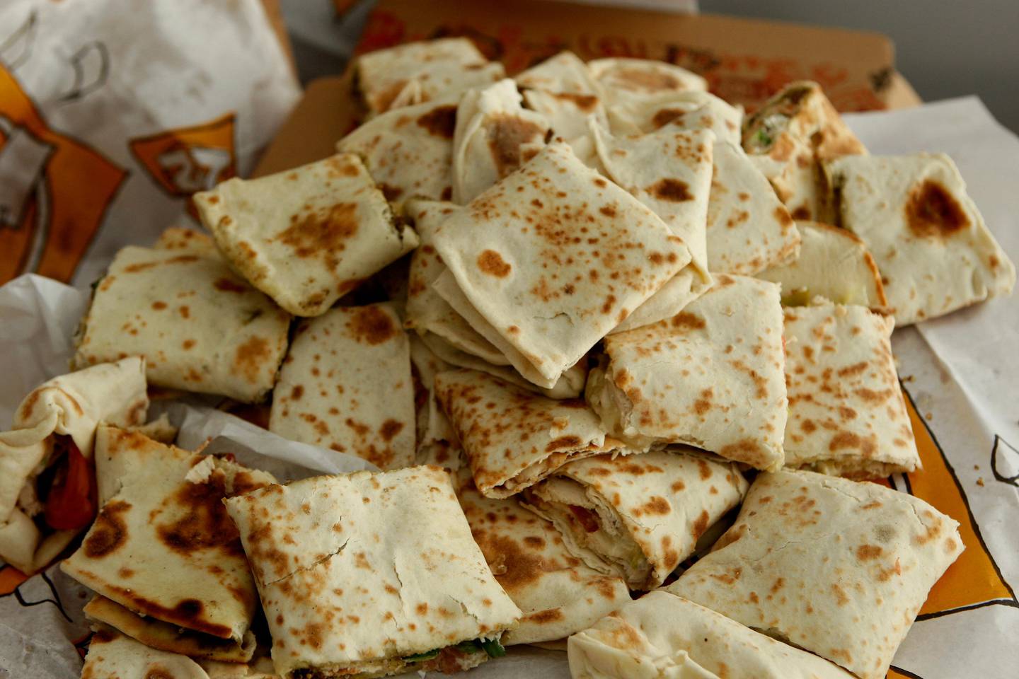 ABU DHABI, UNITED ARAB EMIRATES - November 11, 2008: Food wraps or sandwiches from Zaatar W Zeit restaurant for the Review section. ( Ryan Carter / The National ) *** Local Caption *** RC010-FoodDelivery.JPG