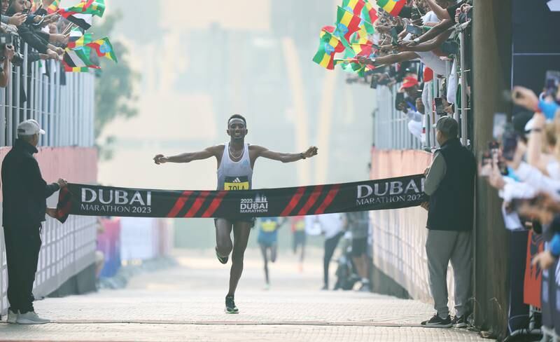 Abdisa Tola Adera celebrates after winning the Dubai Marathon 2023. Getty