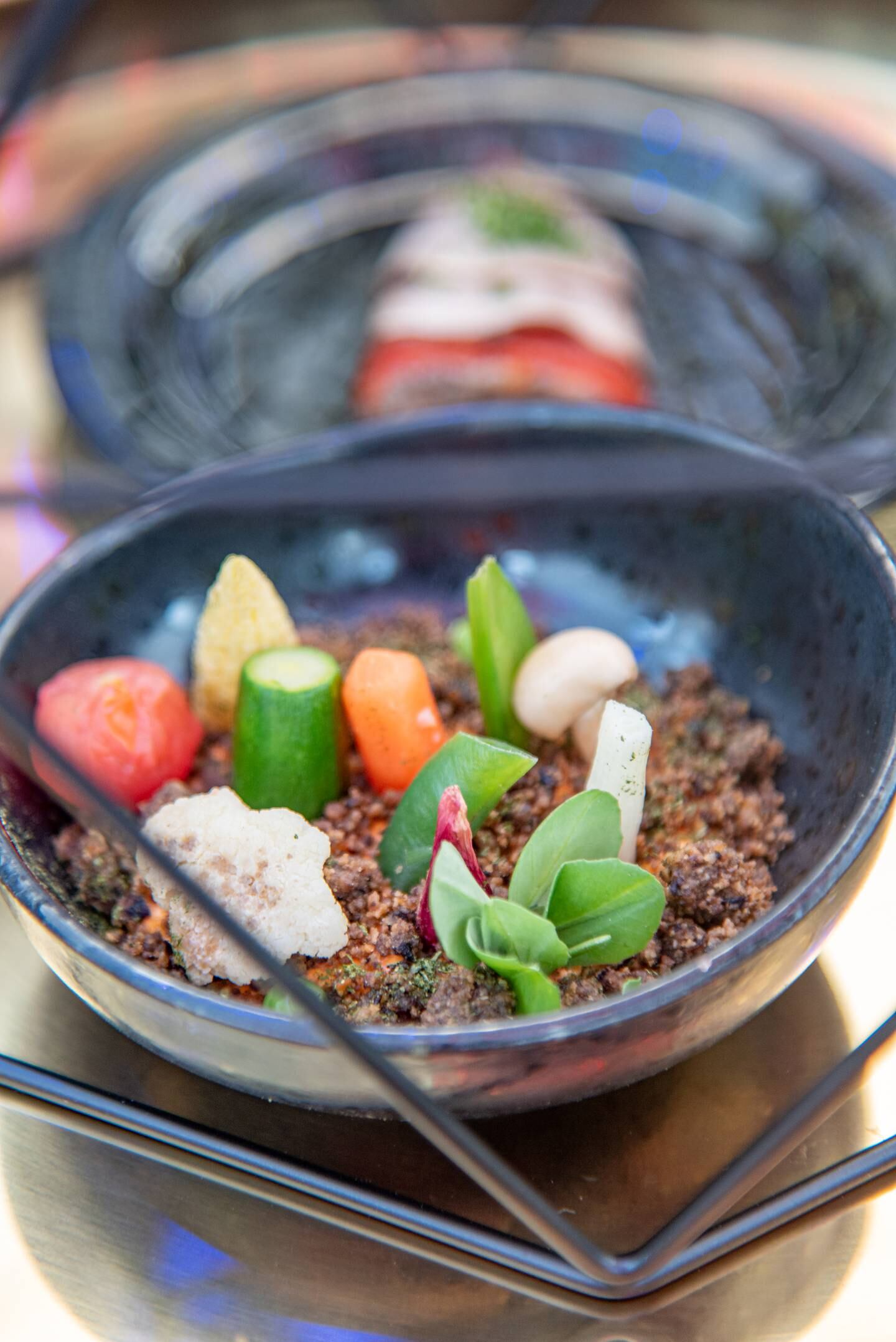 Baby vegetables with Romesco and black olive earth. Photo: Foodlink