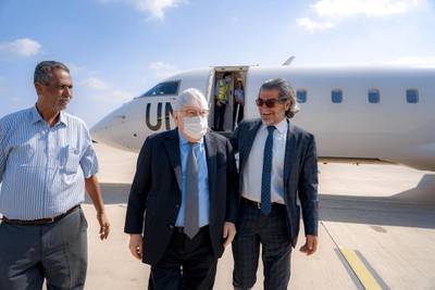 epa08924635 UN Special Envoy for Yemen Martin Griffiths (C) arrives at Aden Airport, Aden, Yemen, 07 January 2021. Griffiths arrived on Aden a day after he met with Saudi-backed Yemen's President Abd-Rabbu Mansour Hadi in Riyadh, and a week after some 26 people were killed in an attack against the newly-formed government upon arrival in Aden.  EPA/AHMED SHEHAB