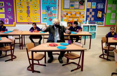 Britain's Prime Minister Boris Johnson joins Year 2 pupils in a maths lesson, during his visit to St Mary's C.E. Primary School in Stoke-on-Trent, central England. AFP