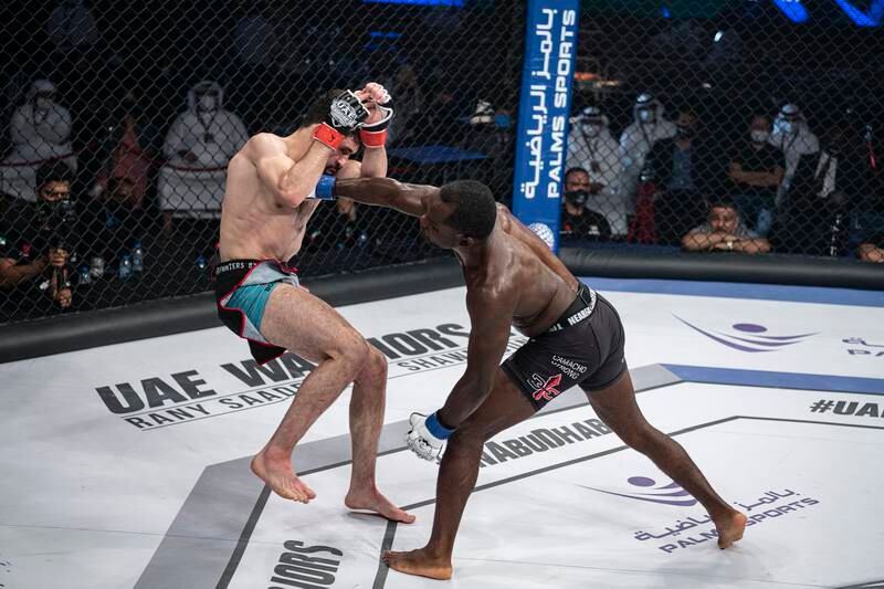 Shawn Bunch lands a right on Rany Saadeh. Photo: UAE Warriors