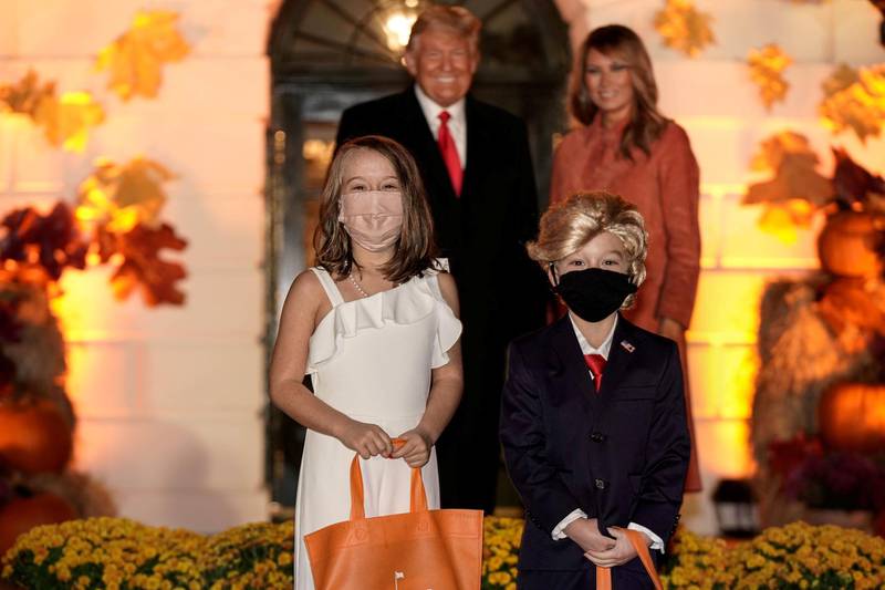 Children dressed as U.S. President Donald Trump and U.S. first lady Melania Trump attend a Halloween event hosted by President Trump and the first lady at the White House in Washington, U.S. REUTERS