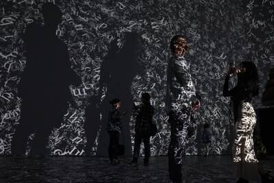 People interact with an artwork installation by artist Rafael Lozano-Hemmer at the Powerhouse Museum in Ultimo, Sydney. EPA