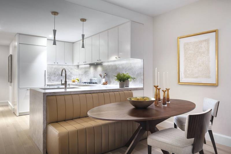 Neutral tones and textures create a sense of calm. Seen here, a space in CetraRuddy's 212 West 72nd Street project, which has a soft colour palette, subtle metallic accents, white lacquer and quartzite in the kitchen, and white oak plank flooring, plus flexibility owing to a booth in place of breakfast stools. Photo: Scott Francis