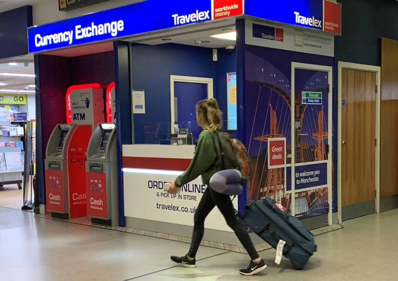 A passenger walks past a Travelex currency exchange at Manchester Airport in Manchester, Britain January 8, 2020. REUTERS/Phil Noble
