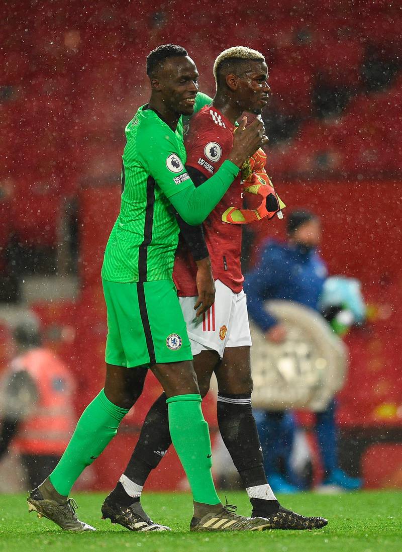 Chelsea's goalkeeper Edouard Mendy and Manchester United's Paul Pogba after the match. EPA