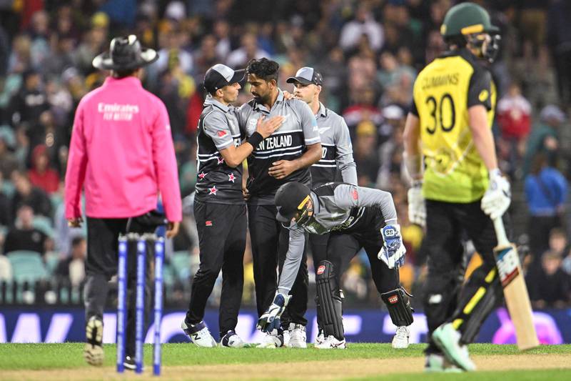 New Zealand players celebrate a wicket during the T20 World Cup match at the Sydney Cricket Ground. AFP