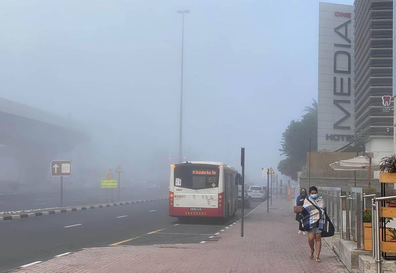 Buses amid the fog in Media City, Dubai. Leslie Pableo for The Natioal