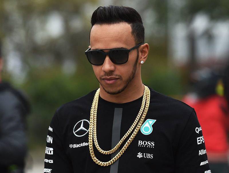 Lewis Hamilton walks in the paddock ahead of the weekend's Chinese Grand Prix in Shanghai on April 9, 2015. Greg Baker / AFP