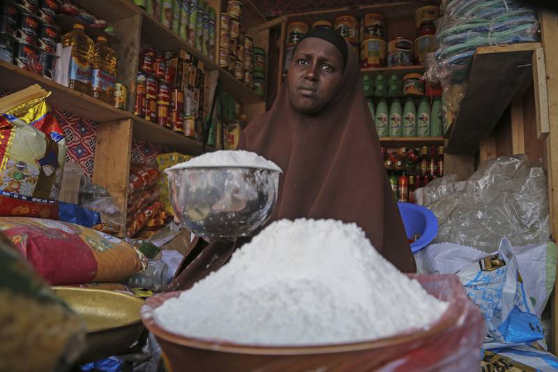 A shopkeeper sells wheat flour in Somalia. The Opec Fund will assist developing countries in covering the import costs of basic commodities amid the Ukraine war. AP