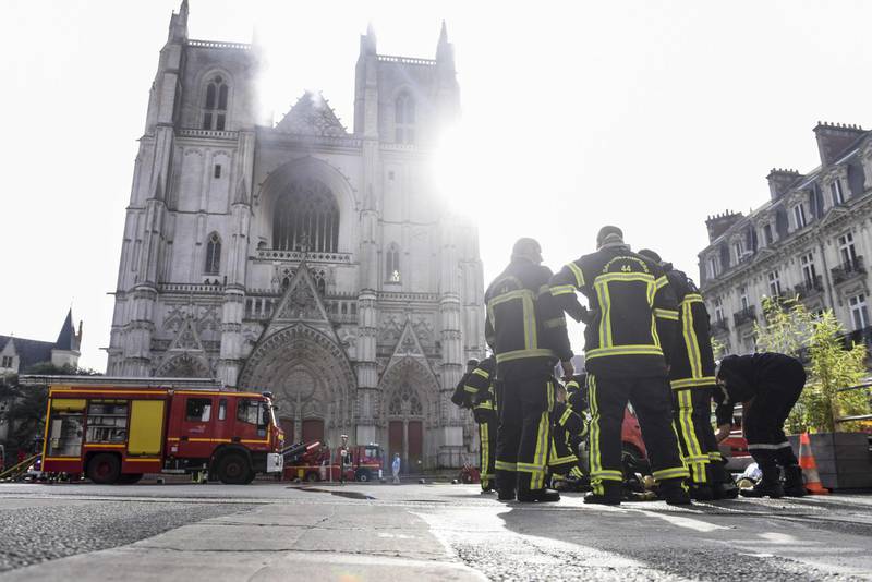 Firefighters are at work to put out a fire at the Saint-Pierre-et-Saint-Paul cathedral. AFP