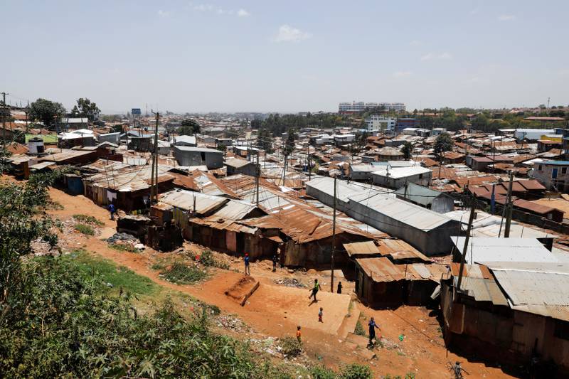 Children play soccer in the Kibera slums in Nairobi, Kenya, March 7, 2022. Reuters