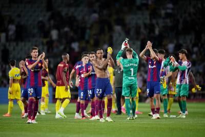 Barcelona players applaud the fans after defeating Cadiz at Olimpic Stadium. Getty