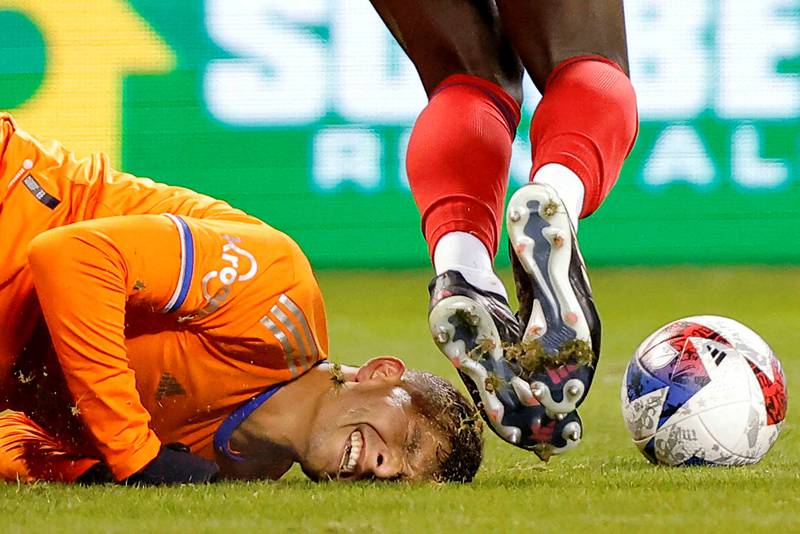 FC Cincinnati forward Brandon Vazquez hits the turf after a tackle against Chicago Fire midfielder Carlos Teran during the first half of a 3-3 MLS Eastern Conference draw at Soldier Field on Saturday. Reuters
