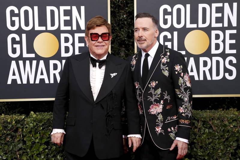 Elton John and David Furnish arrive for the 77th annual Golden Globe Awards.  EPA