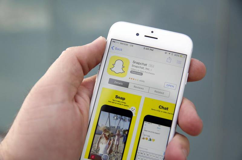 The Snapchat app has fallen foul of telecoms regulations in the UAE but it has many fans. Patrick T Fallon / Bloomberg